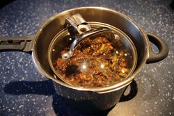 The saucepan inside the pressure cooker