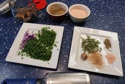 Herbs and spices for Oxford sausages. Chives, parsley, sage, thyme, nutmeg, salt and black pepper. As you can see, I like a herby sausage. I eventually halved the amount of salt pictured