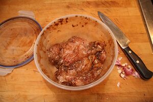 Chicken breasts marinading in crushed garlic, balsamic vinegar and Mexican oregano