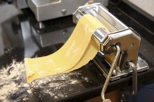 Dust liberally with flour to prevent sticking; start it off as one sheet, then join the ends together