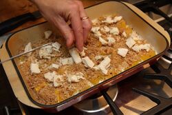 Squash gratin, adding the goats' cheese