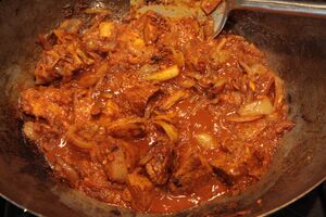 stir-frying pork vindaloo