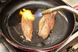 Browning the duck breasts on both sides