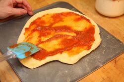 Spreading out the topping