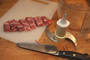 Roughly slice the lamb fillet and then blitz in a food processor with a metal blade