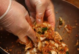 Mix well using rubber gloves