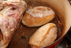 Browning the duck breasts