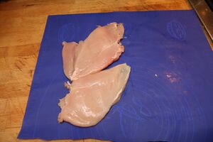 Two flattened chicken breasts