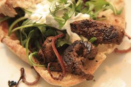 With wild rocket, yogurt and made-made pitta breads