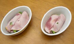 Leeks rolled in ham, ready for the sauce