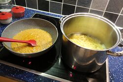 Boiling the fresh pasta and simmering the sauce