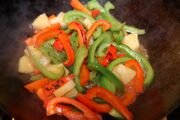 Peppers browned, simmering in stock