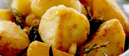 Oven roasted rooster potatoes with garlic and rosemary