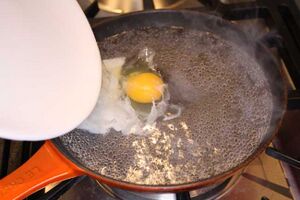 Slide the egg off a saucer
