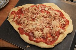 Base part-baked and brown shrimp and crabmeat added