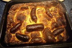 Perfectly cooked toad in the hole - crispy edges, soft middle